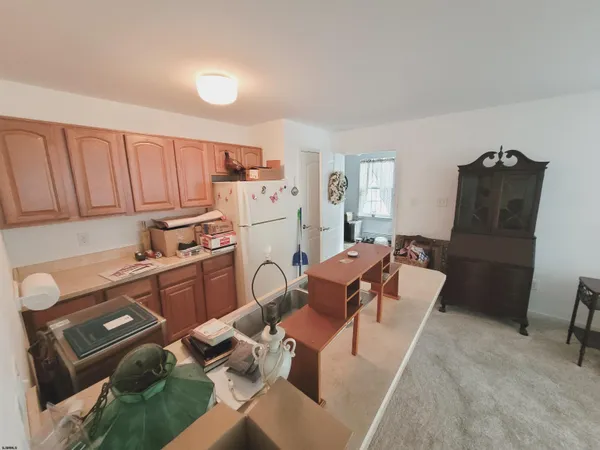 a bedroom with furniture and a mirror