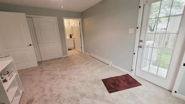 a bathroom with a sink mirror vanity and toilet