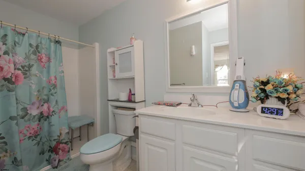 a view of a house with backyard sitting area and sitting area