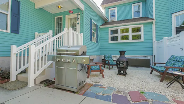 a balcony with table and chairs