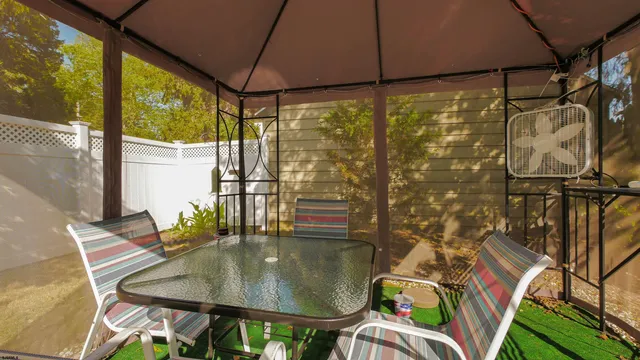 a front view of house with yard patio and green space