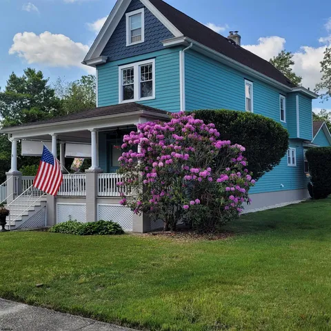 an aerial view of a house with a garden