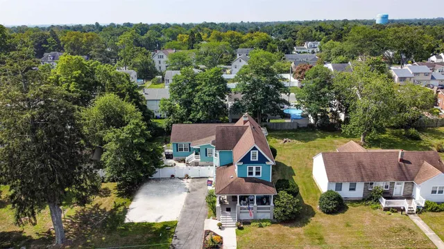 an aerial view of house with yard