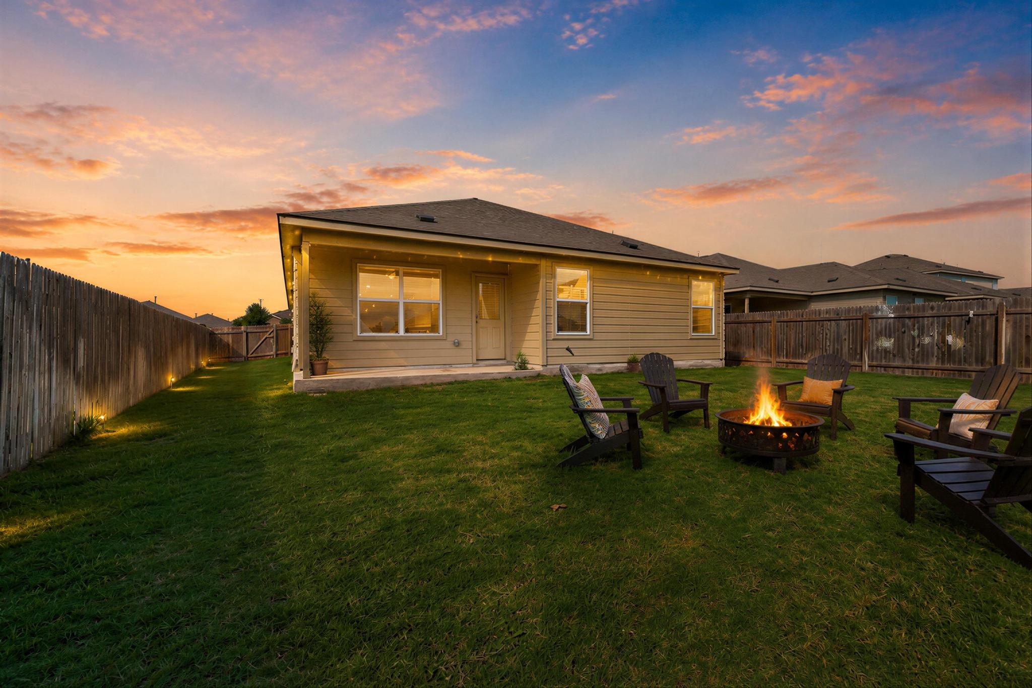 133 Konik Road Georgetown, TX 78626 - Photo 28 of 29 a backyard of a house with table and chairs
