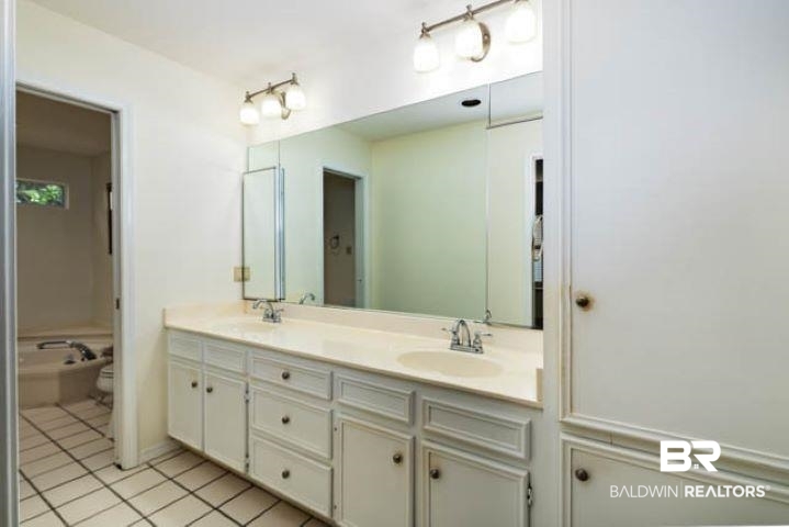 12 Stonebridge Court Mobile, AL 36608 - Photo 38 of 38 Bathroom with light tile patterned flooring and double vanity