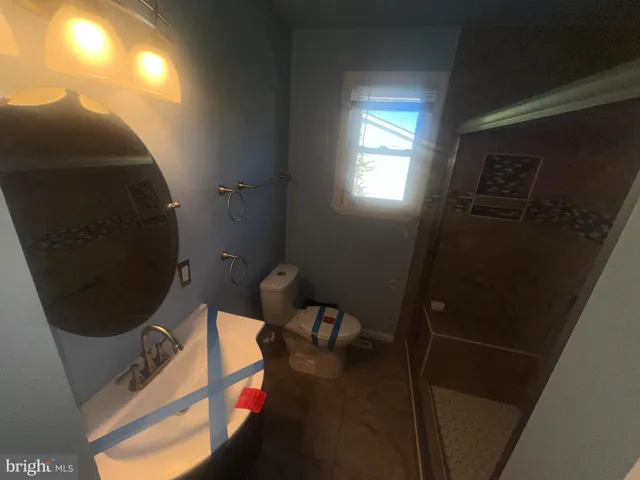 a bathroom with a toilet and a sink