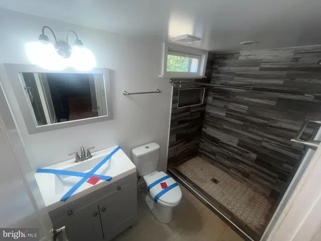 a view of an empty room and wooden floor