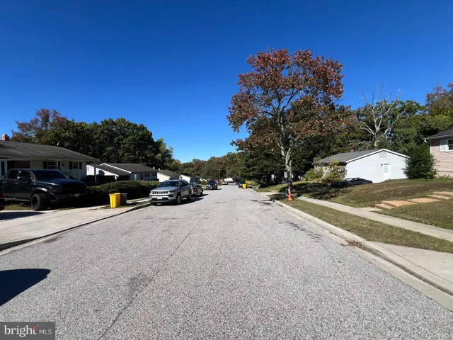 a view of street with parked cars