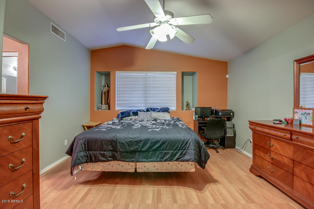 5362 West Pecan Road Laveen, AZ 85339 - Photo 13 of 28 a bedroom with a bed and a dresser