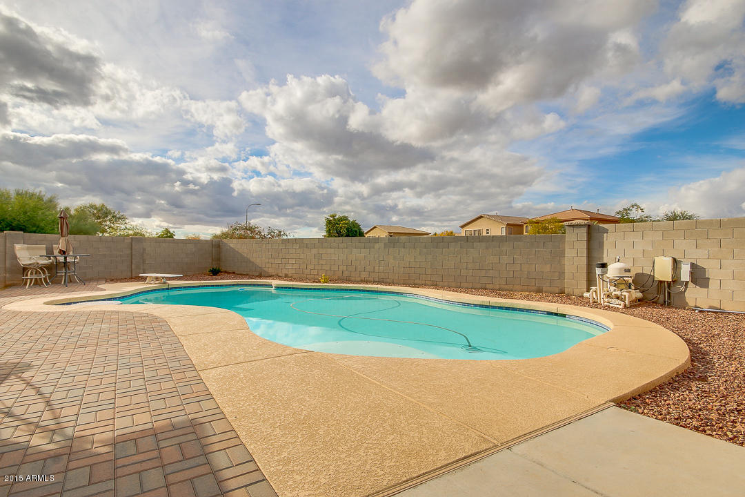 5362 West Pecan Road Laveen, AZ 85339 - Photo 25 of 28 a view of a swimming pool and a yard