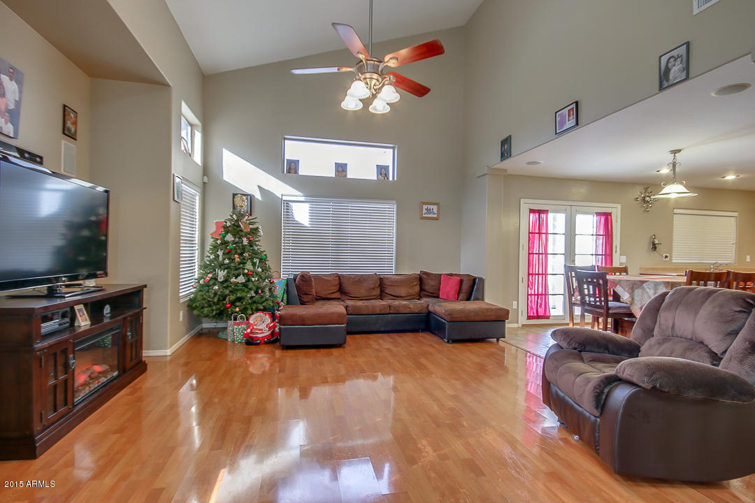 5362 West Pecan Road Laveen, AZ 85339 - Photo 5 of 28 a living room with furniture and a flat screen tv