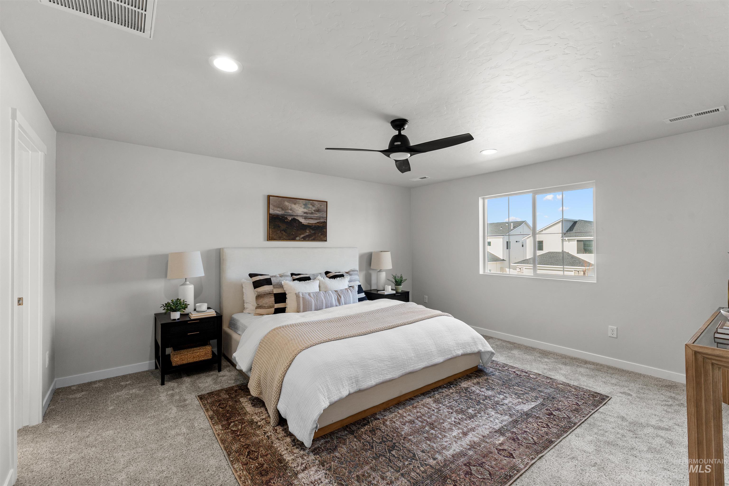 2526 West Fallon Loop Nampa, ID 83651 - Photo 28 of 32 Bedroom featuring light colored carpet, ceiling fan, and recessed lighting