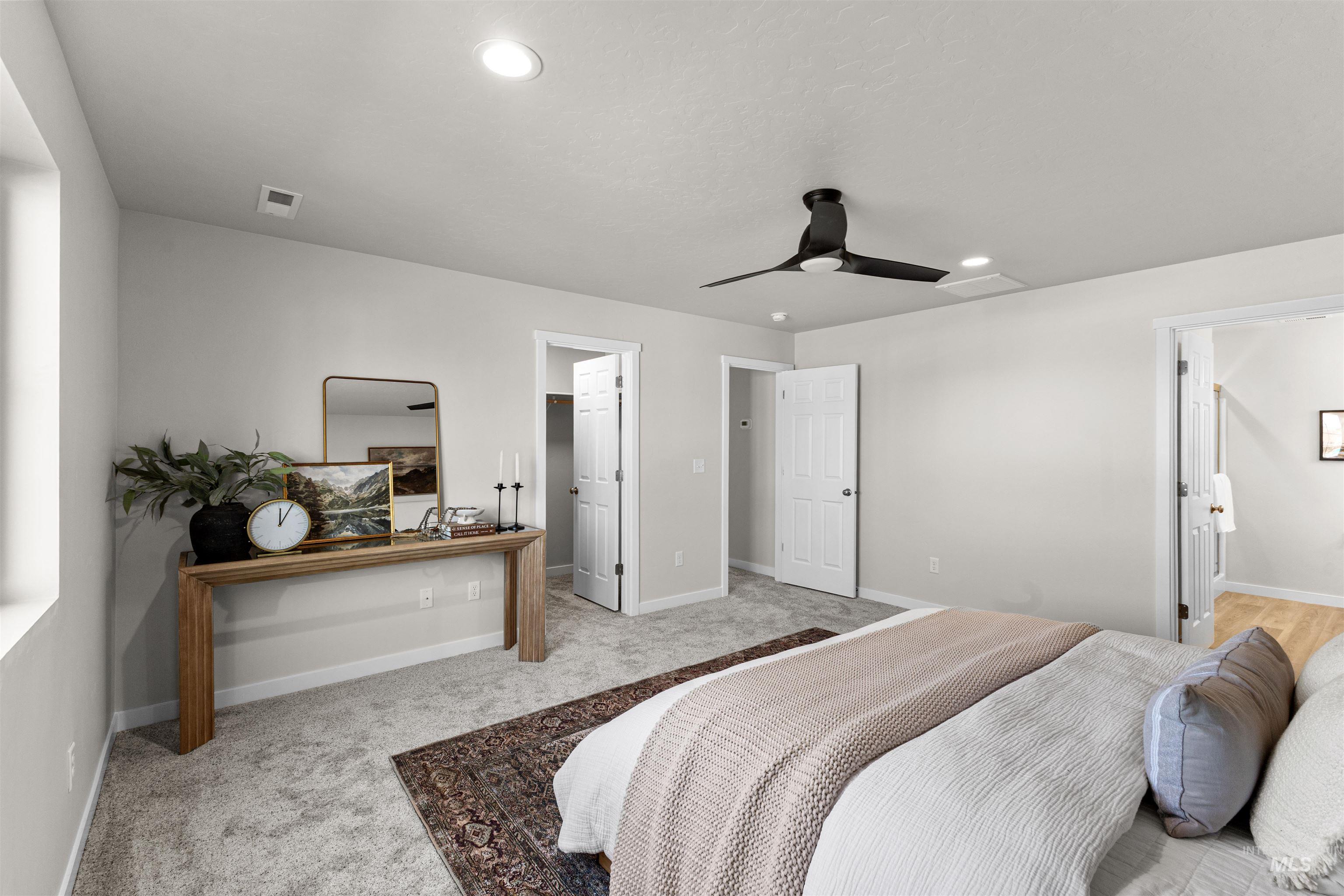 2526 West Fallon Loop Nampa, ID 83651 - Photo 29 of 32 Bedroom with ensuite bathroom, ceiling fan, light colored carpet, and recessed lighting
