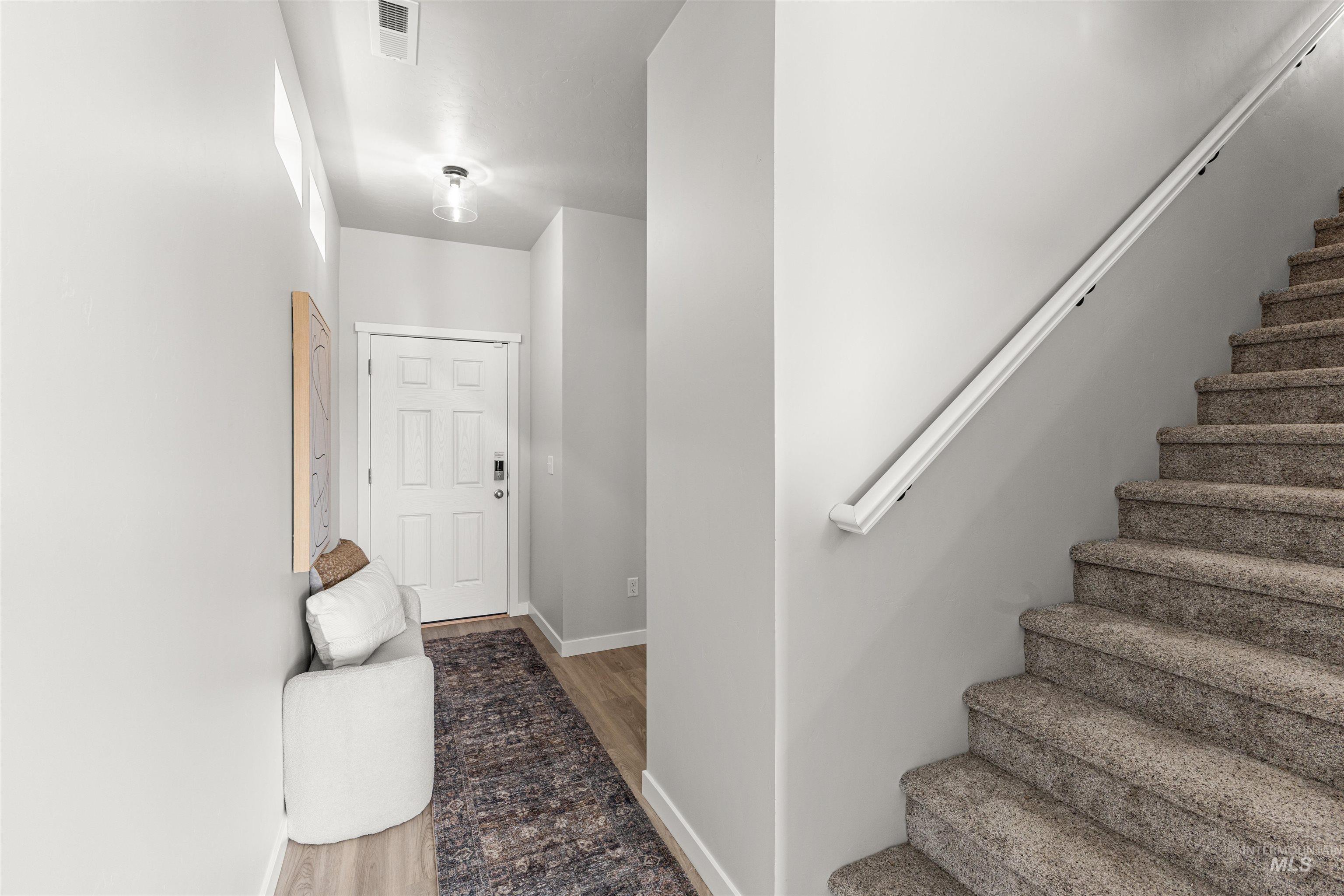 2526 West Fallon Loop Nampa, ID 83651 - Photo 3 of 32 Stairway with baseboards and wood finished floors
