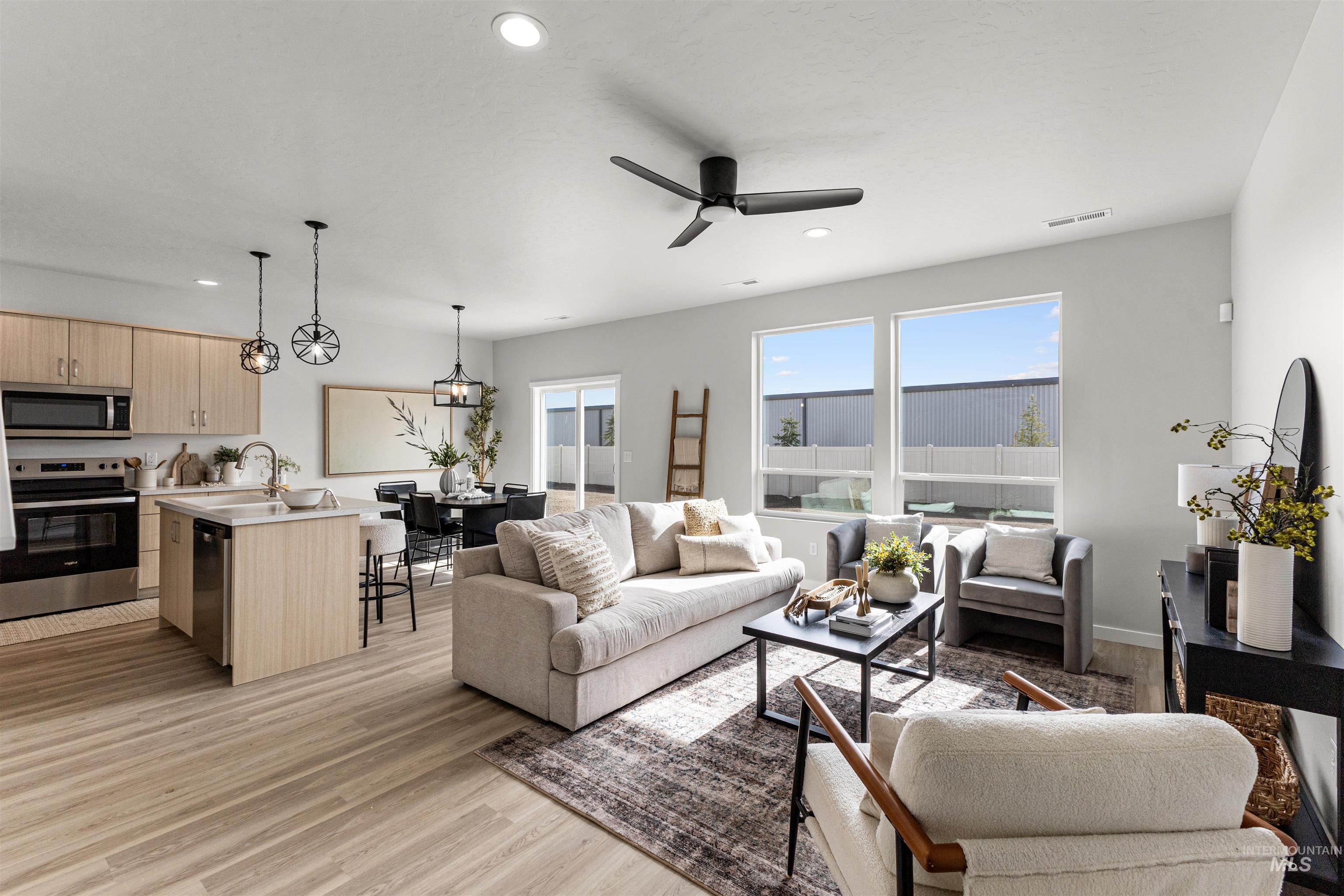 2526 West Fallon Loop Nampa, ID 83651 - Photo 4 of 32 Living room featuring ceiling fan, light wood-style floors, healthy amount of natural light, and recessed lighting