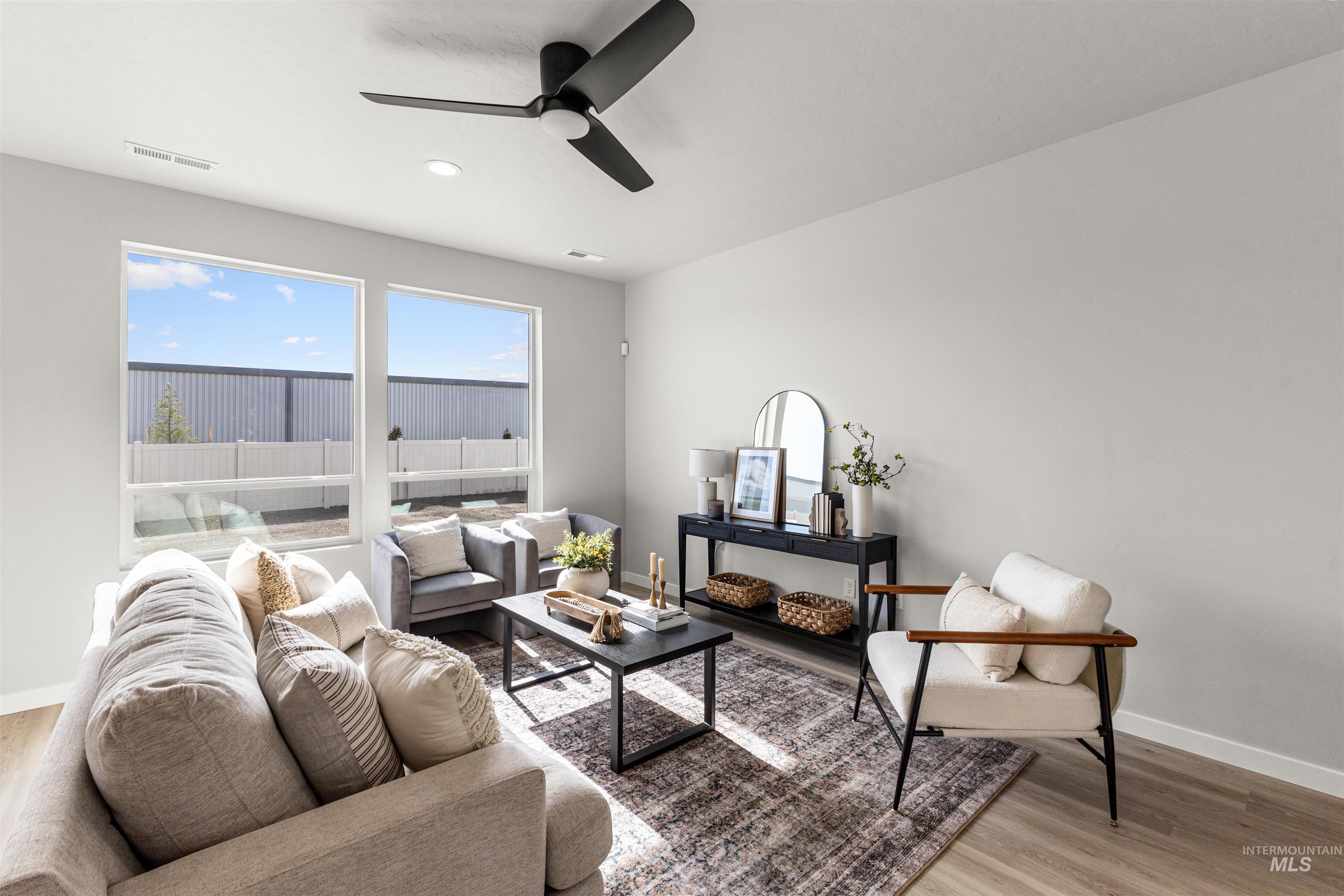 2526 West Fallon Loop Nampa, ID 83651 - Photo 5 of 32 Living room with light wood-style flooring and ceiling fan