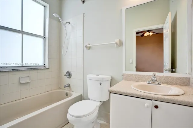 a bathroom with a sink toilet tub and shower