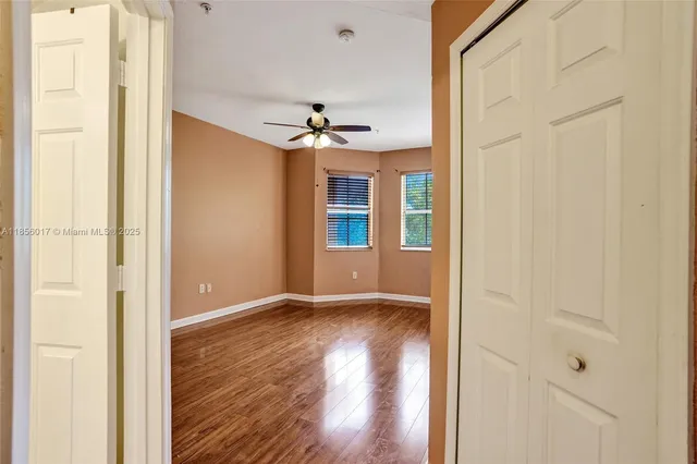 a kitchen with white cabinets a sink dishwasher and a stove