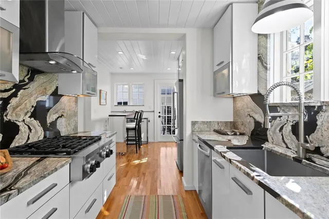 a view of a chairs and table in the balcony