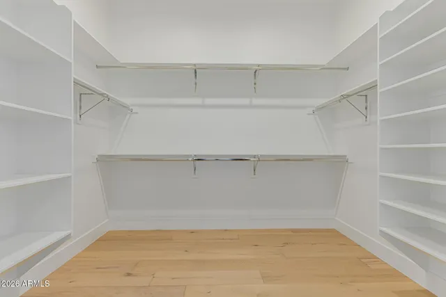 a bathroom with a granite countertop shower a mirror and a sink