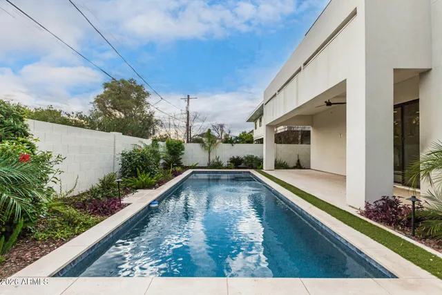 a view of swimming pool with outdoor seating