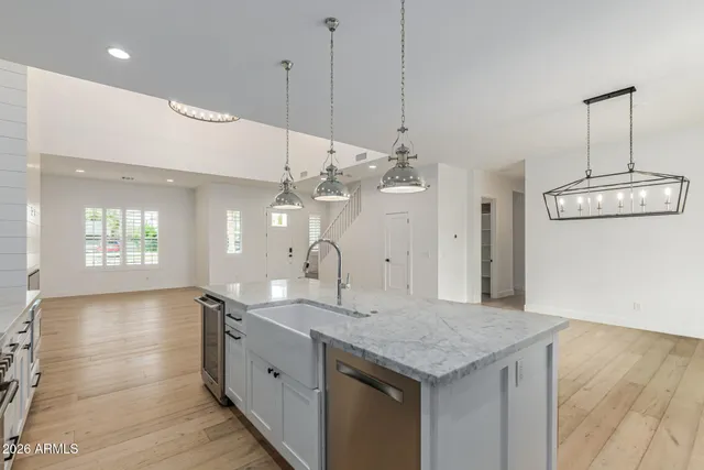 a kitchen with a stove a sink and a refrigerator