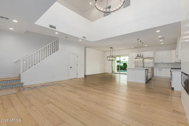 a view of an empty room with window and fireplace