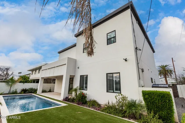a house view with a backyard space