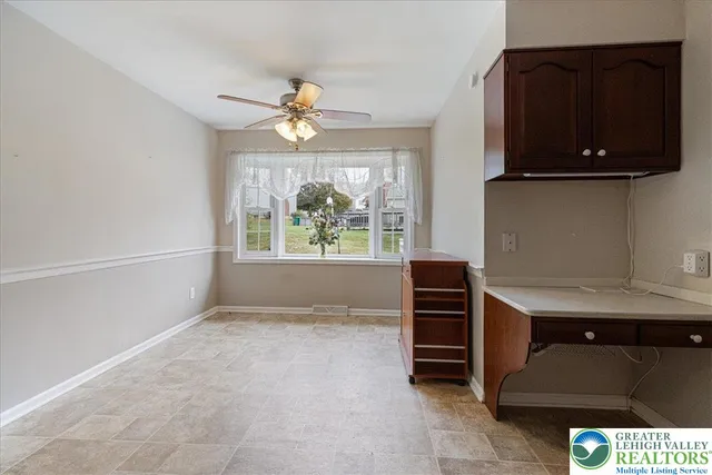 wooden floor fireplace and natural light in room