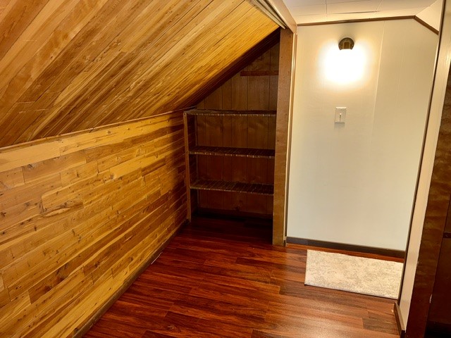 1701 West Jefferson Street Springfield, OH 45506 - Photo 16 of 18 This cozy attic features rich wood paneling and practical storage shelves.