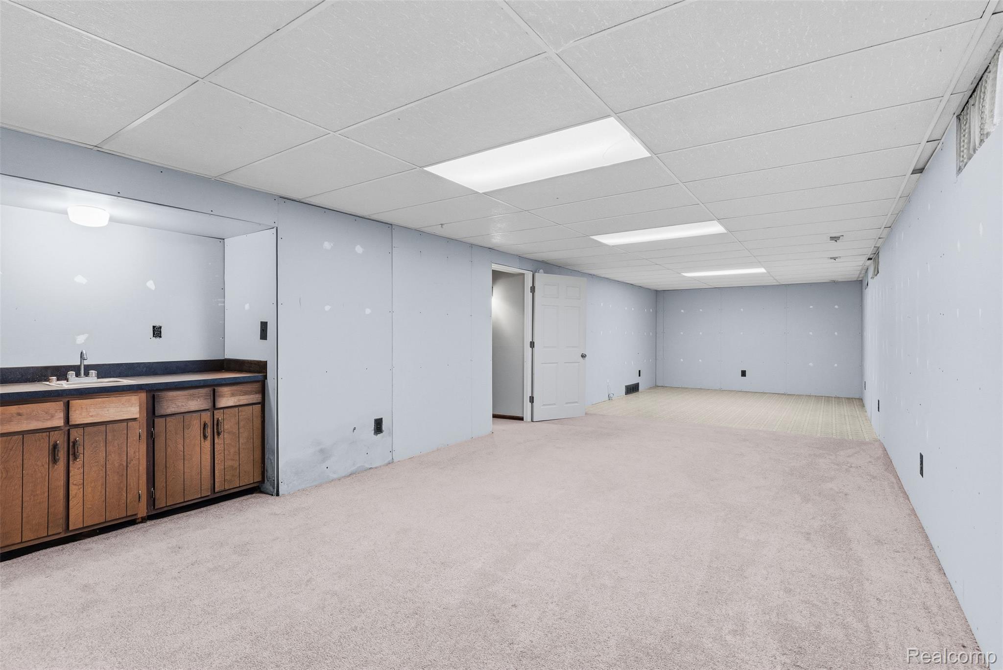 4191 McCandlish Road Grand Blanc, MI 48439 - Photo 39 of 53 Finished basement featuring a drop ceiling and light colored carpet