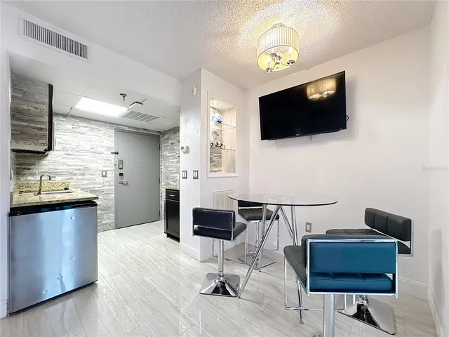 a view of kitchen with sink and wooden floor
