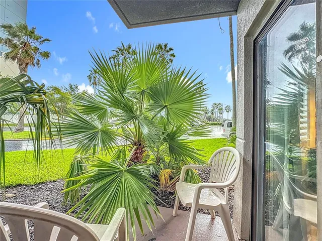 a view of a swimming pool with a seating space
