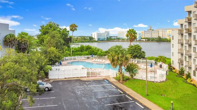 a view of a yard with cars park
