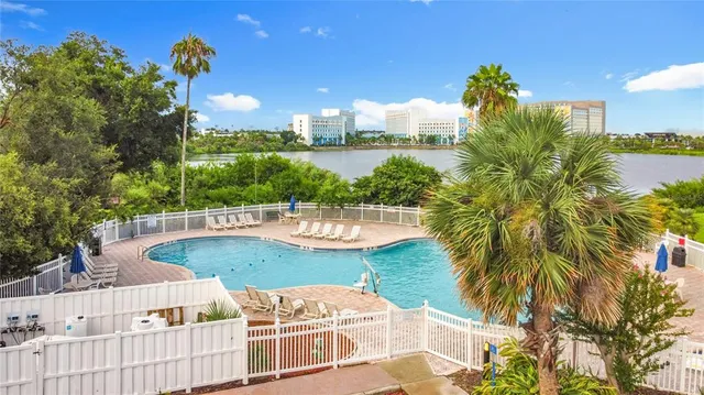 a view of a swimming pool with a patio