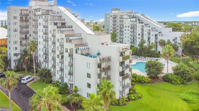 a view of building with yard and staircase