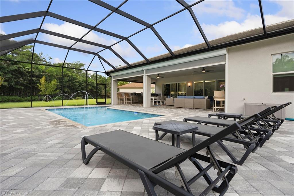 12083 Azalea Way Naples, FL 34120 - Photo 15 of 48 Relax poolside to take in the sun or serene preserve views.