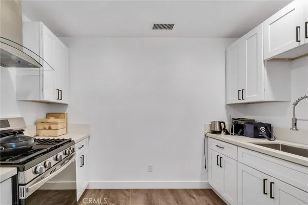 a living room with furniture and a lamp