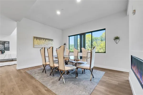 a living room with furniture a rug and a window