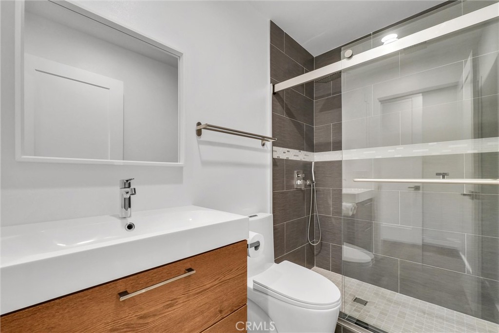 1911 Tumin Road La Habra Heights, CA 90631 - Photo 18 of 43 a bathroom with a sink mirror toilet and shower