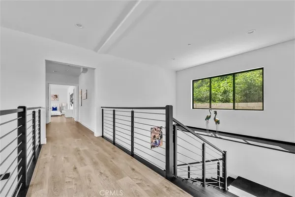 a bedroom with a large bed and a large window