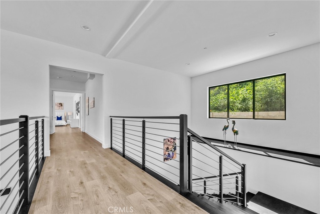 1911 Tumin Road La Habra Heights, CA 90631 - Photo 21 of 43 a view of a hallway with wooden floor and stairs