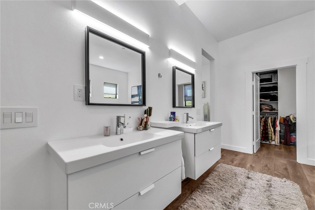 1911 Tumin Road La Habra Heights, CA 90631 - Photo 27 of 43 a spacious bathroom with a double vanity sink and a mirror