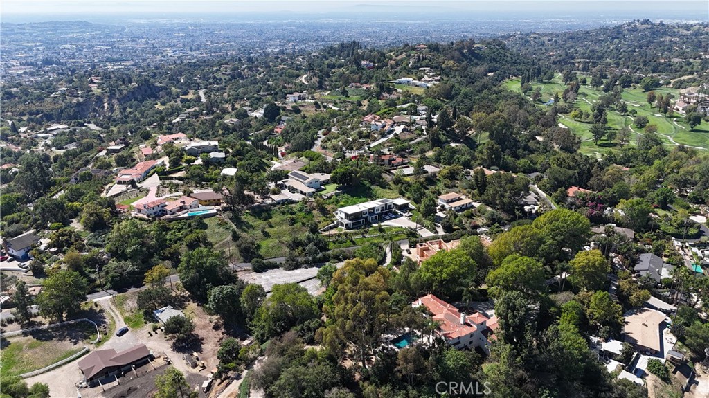 1911 Tumin Road La Habra Heights, CA 90631 - Photo 3 of 43 an aerial view of a houses with a lush green hillside