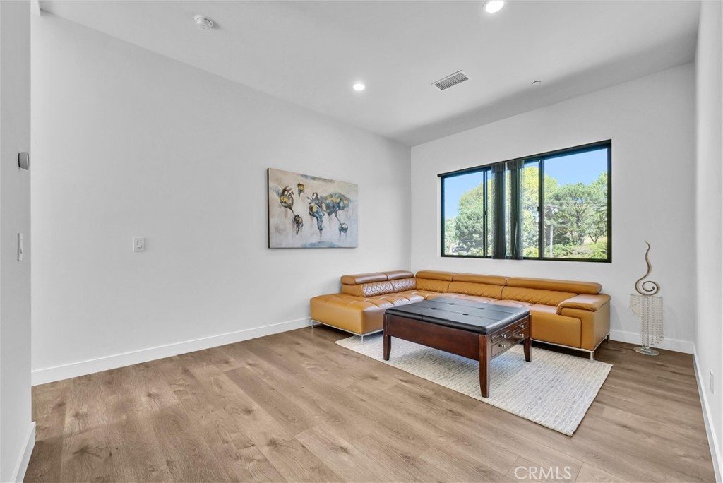 1911 Tumin Road La Habra Heights, CA 90631 - Photo 33 of 43 a living room with furniture a rug and a window