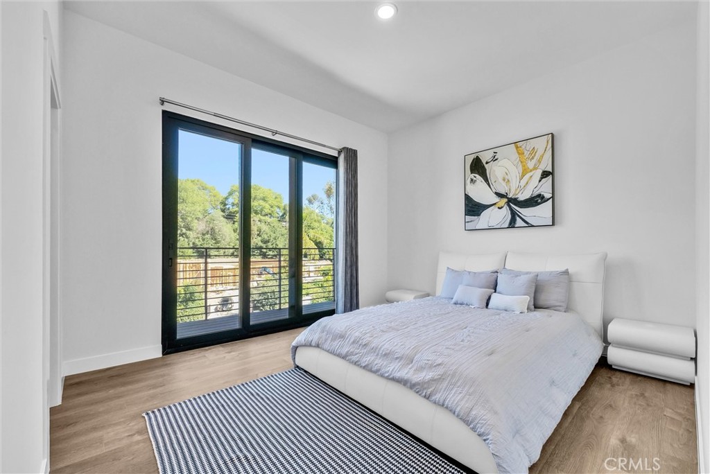 1911 Tumin Road La Habra Heights, CA 90631 - Photo 40 of 43 a bedroom with a large bed and a large window