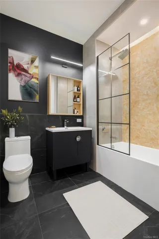 a bathroom with a sink toilet and mirror