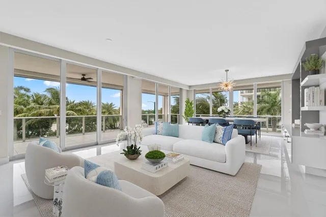 a large white kitchen with a large window