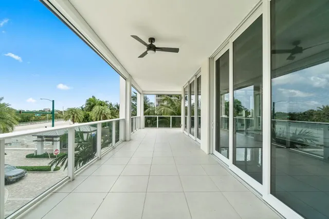 an aerial view of a city with lots of residential buildings ocean and mountain view