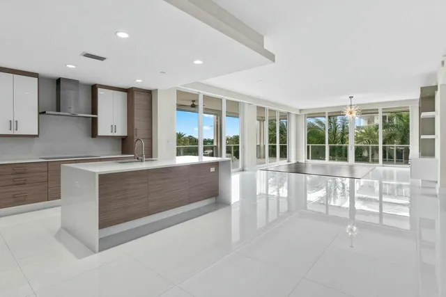a spacious bathroom with a sink and a large mirror